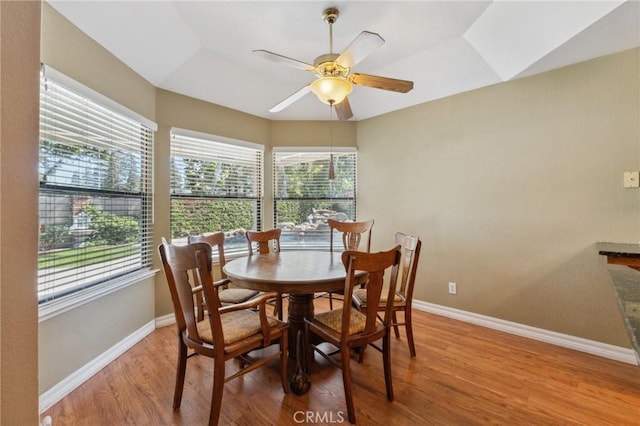 689 E Pintail Cir, Fresno, CA 93730 - dining room with baseboards, lofted ceiling, ceiling fan, and wood finished floors