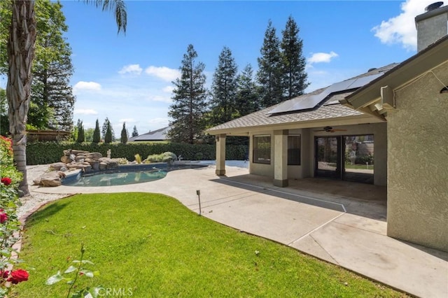 689 E Pintail Cir, Fresno, CA 93730 - view of yard featuring a patio, a fenced in pool, and a ceiling fan