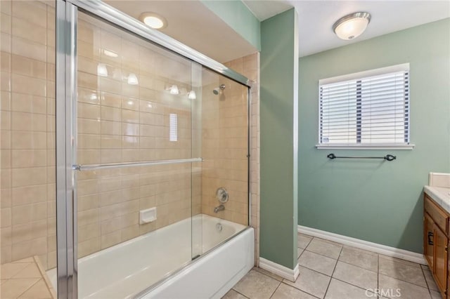 689 E Pintail Cir, Fresno, CA 93730 - bathroom with tile patterned floors, enclosed tub / shower combo, baseboards, and vanity