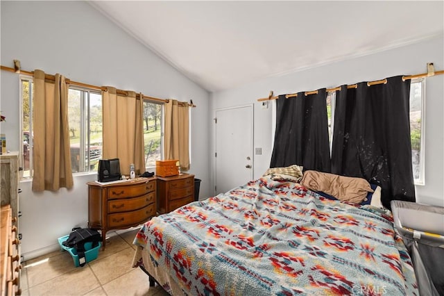 tiled bedroom with lofted ceiling