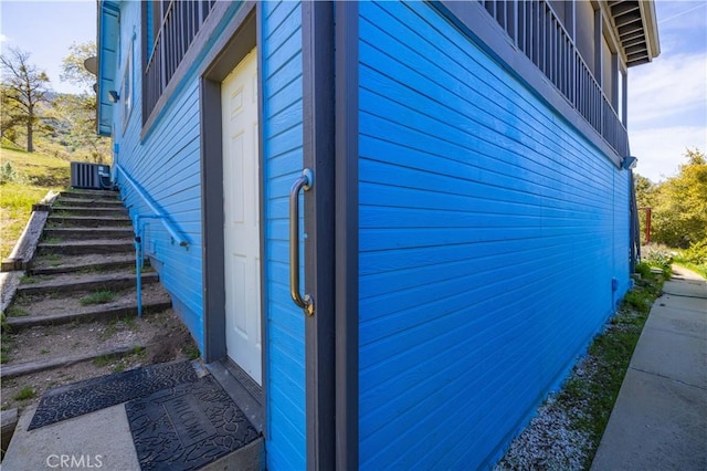 view of side of property featuring central AC unit