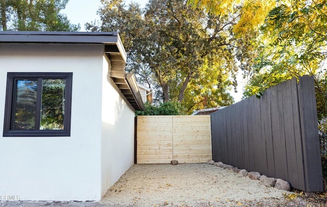 view of side of home featuring stucco siding
