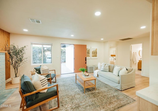 living room with recessed lighting and light wood finished floors