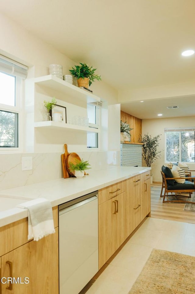 kitchen with open shelves, dishwasher, light brown cabinetry, tasteful backsplash, and light countertops