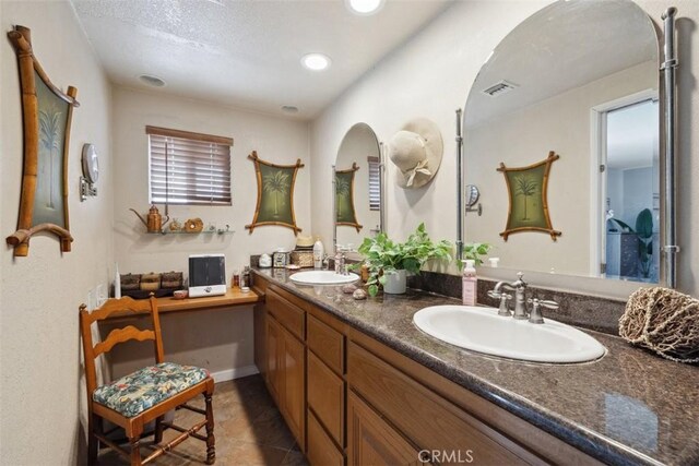 1675 Bridget Ave, Simi Valley, CA 93065 - bathroom featuring double vanity, tile patterned floors, and recessed lighting
