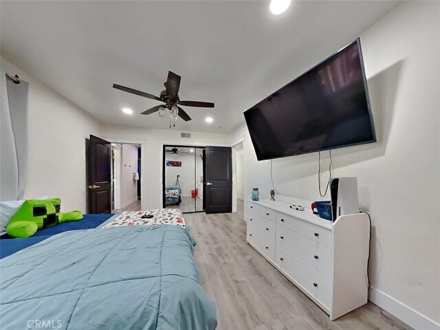 bedroom with recessed lighting, ceiling fan, baseboards, and light wood-type flooring