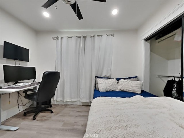 bedroom with recessed lighting, light wood finished floors, baseboards, and a ceiling fan