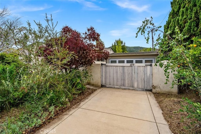 view of gate with fence