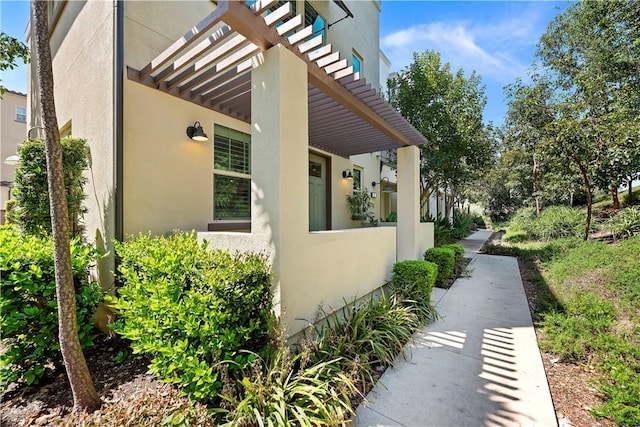 9 Adelfa St, Rancho Mission Viejo, CA 92694 - view of home's exterior with a pergola and stucco siding