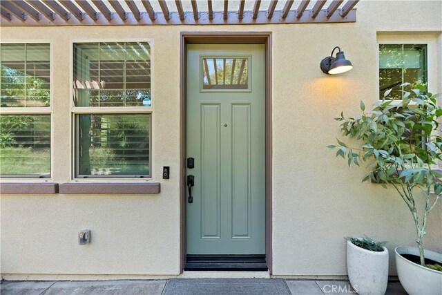 9 Adelfa St, Rancho Mission Viejo, CA 92694 - doorway to property featuring a tile roof and stucco siding