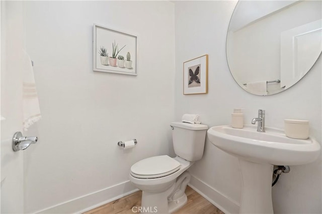 9 Adelfa St, Rancho Mission Viejo, CA 92694 - bathroom featuring wood finished floors, baseboards, and toilet