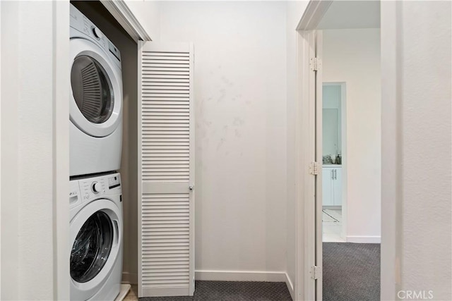 9 Adelfa St, Rancho Mission Viejo, CA 92694 - washroom featuring baseboards, stacked washer and clothes dryer, carpet, and laundry area