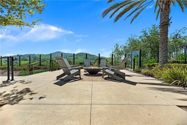 9 Adelfa St, Rancho Mission Viejo, CA 92694 - view of patio / terrace with a mountain view, fence, and an outdoor fire pit