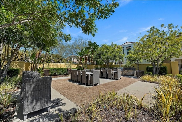 9 Adelfa St, Rancho Mission Viejo, CA 92694 - view of patio / terrace with exterior kitchen, outdoor dining space, and fence