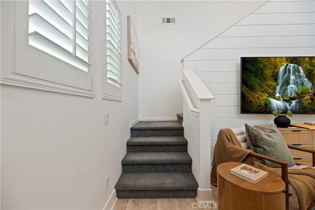 9 Adelfa St, Rancho Mission Viejo, CA 92694 - stairs with baseboards, wood finished floors, and visible vents