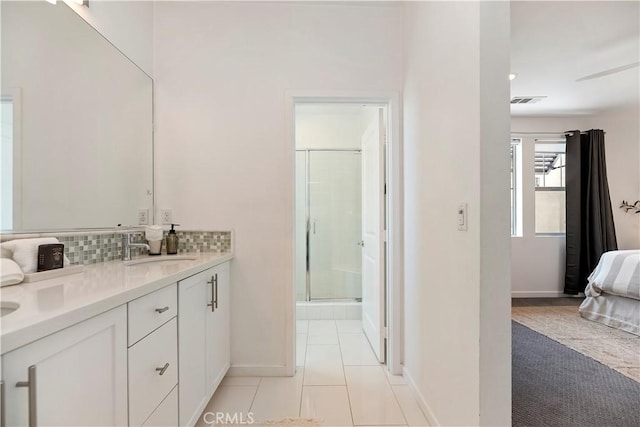 9 Adelfa St, Rancho Mission Viejo, CA 92694 - full bath with a shower stall, backsplash, visible vents, a sink, and baseboards