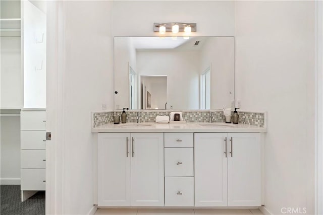 9 Adelfa St, Rancho Mission Viejo, CA 92694 - bathroom featuring decorative backsplash, baseboards, a sink, and double vanity