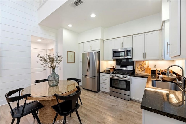 9 Adelfa St, Rancho Mission Viejo, CA 92694 - kitchen featuring appliances with stainless steel finishes, light wood finished floors, a sink, and visible vents