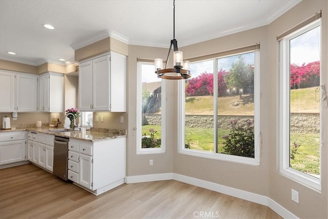 kitchen featuring dishwasher, a notable chandelier, a sink, and white cabinetry