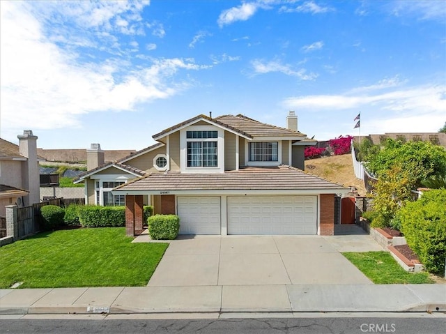 traditional home with a tile roof, concrete driveway, a chimney, fence, and a garage