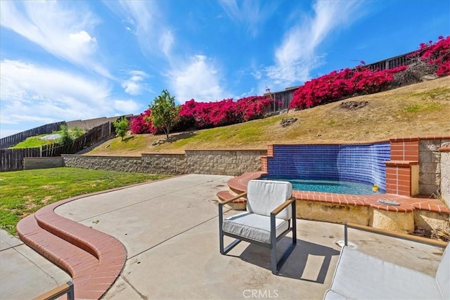 view of patio featuring a fenced backyard and a swimming pool