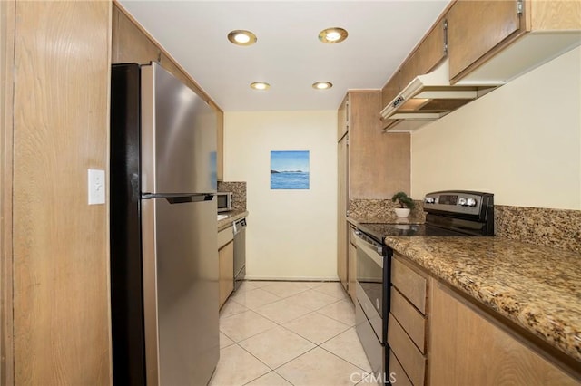 615 Esplanade Unit 302, Redondo Beach, CA 90277 - kitchen with appliances with stainless steel finishes, under cabinet range hood, light tile patterned floors, recessed lighting, and baseboards