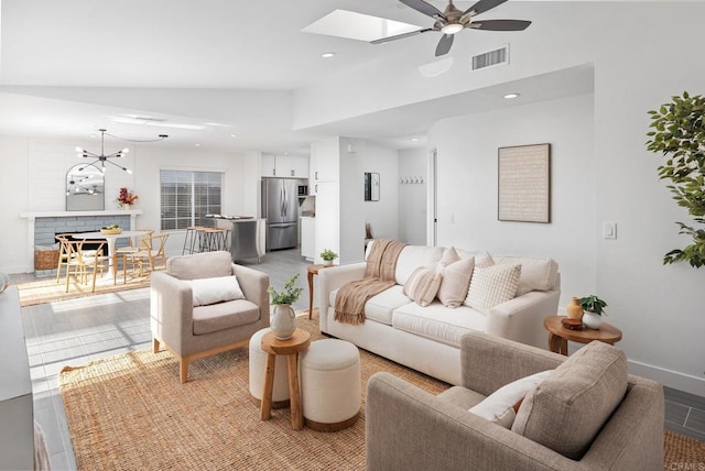 6770 Amberly St, San Diego, CA 92120 - living room featuring ceiling fan, a skylight, recessed lighting, baseboards, and a chandelier