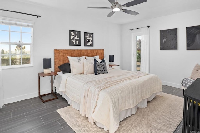 6770 Amberly St, San Diego, CA 92120 - bedroom with baseboards, dark wood-type flooring, ceiling fan, and access to outside