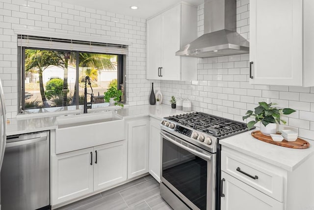 6770 Amberly St, San Diego, CA 92120 - kitchen featuring appliances with stainless steel finishes, wall chimney exhaust hood, a sink, light countertops, and recessed lighting