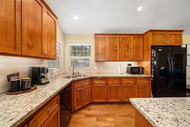 2103 Price St, San Luis Obispo, CA 93401 - kitchen with backsplash, a sink, light wood-style floors, and black appliances
