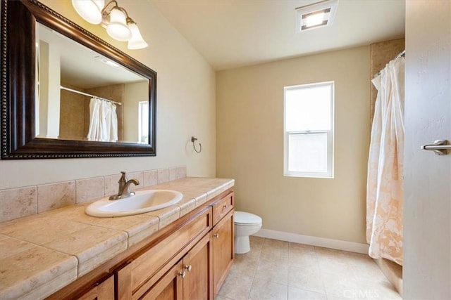 2103 Price St, San Luis Obispo, CA 93401 - full bathroom featuring toilet, vanity, tile patterned floors, and baseboards