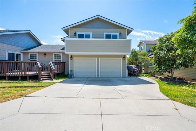 2103 Price St, San Luis Obispo, CA 93401 - view of front of house with a wooden deck, an attached garage, and concrete driveway