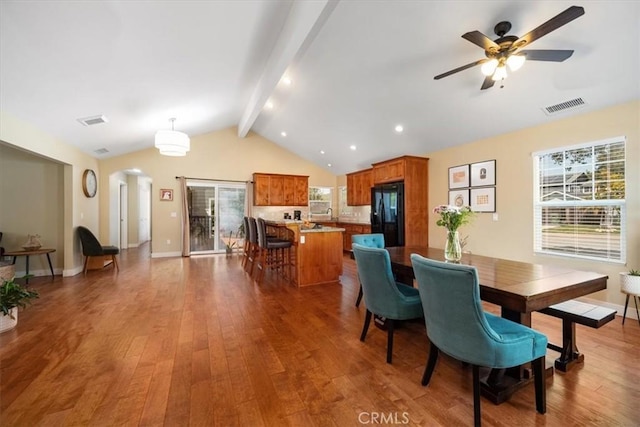 2103 Price St, San Luis Obispo, CA 93401 - dining area with lofted ceiling with beams, wood finished floors, visible vents, and arched walkways