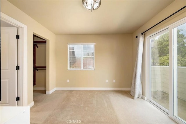 2103 Price St, San Luis Obispo, CA 93401 - unfurnished bedroom featuring light carpet, a closet, access to exterior, and baseboards