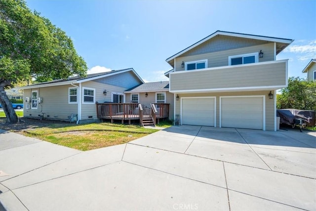 2103 Price St, San Luis Obispo, CA 93401 - view of front of house with a wooden deck, an attached garage, and concrete driveway