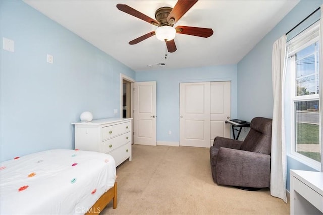 2103 Price St, San Luis Obispo, CA 93401 - bedroom with baseboards, light carpet, a ceiling fan, and a closet