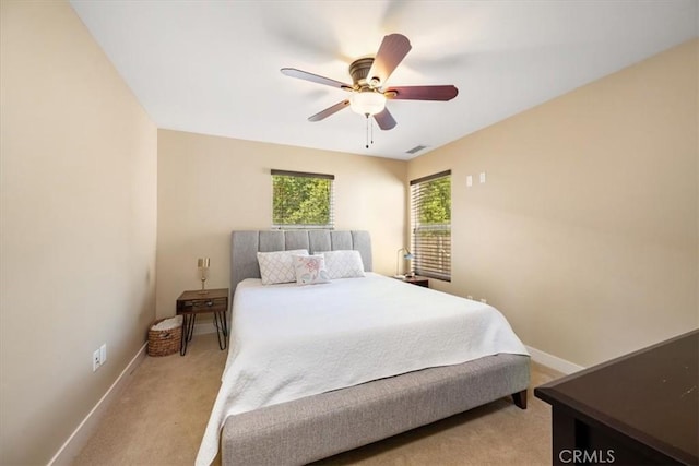 2103 Price St, San Luis Obispo, CA 93401 - bedroom featuring light colored carpet, baseboards, a ceiling fan, and visible vents