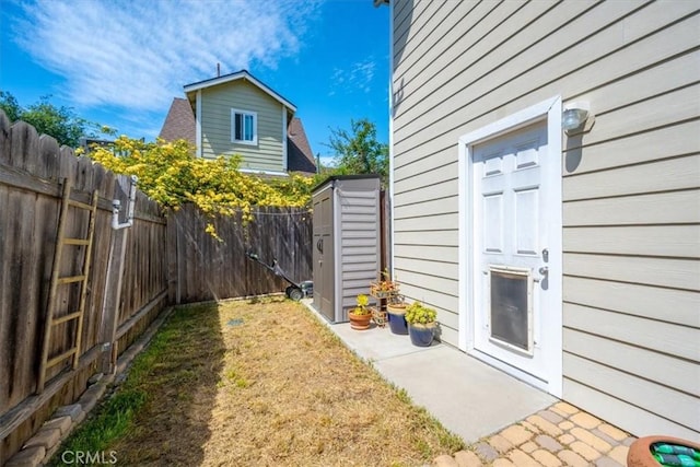 2103 Price St, San Luis Obispo, CA 93401 - view of yard with a fenced backyard, an outdoor structure, and a shed