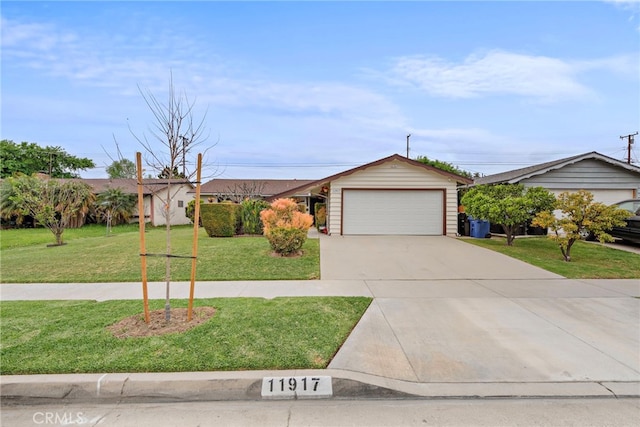 single story home featuring a garage, driveway, and a front yard