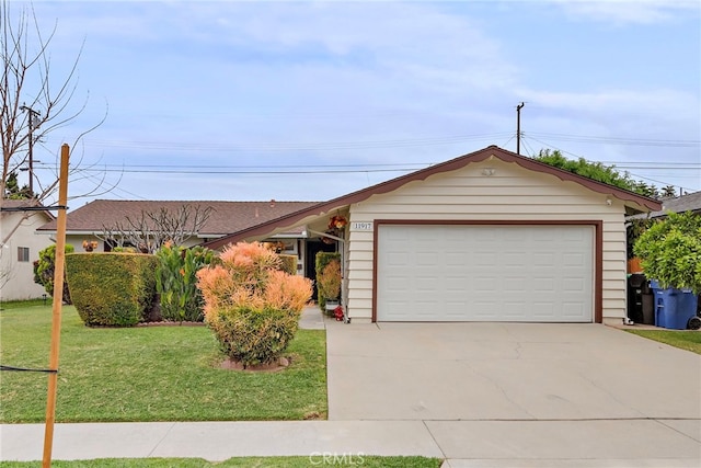 ranch-style home with an attached garage, driveway, and a front lawn