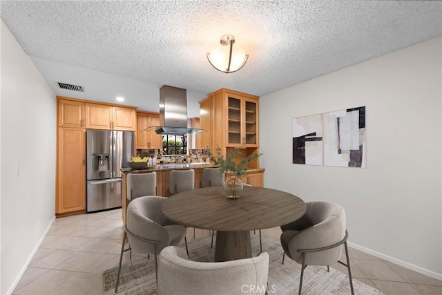 dining area featuring a textured ceiling, visible vents, baseboards, recessed lighting, and light tile patterned flooring
