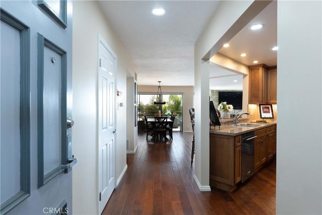 2270 Stanley Ave Unit 2B, Signal Hill, CA 90755 - kitchen with dishwasher, a sink, baseboards, dark wood-style flooring, and brown cabinetry