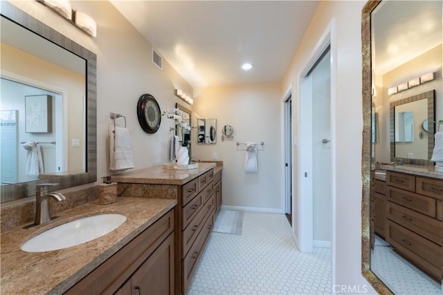 2270 Stanley Ave Unit 2B, Signal Hill, CA 90755 - full bathroom with two vanities, baseboards, and recessed lighting