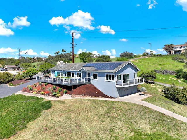 4710 Sleeping Indian Rd, Fallbrook, CA 92028 - view of front of house featuring stucco siding, a wooden deck, aphalt driveway, and a front lawn