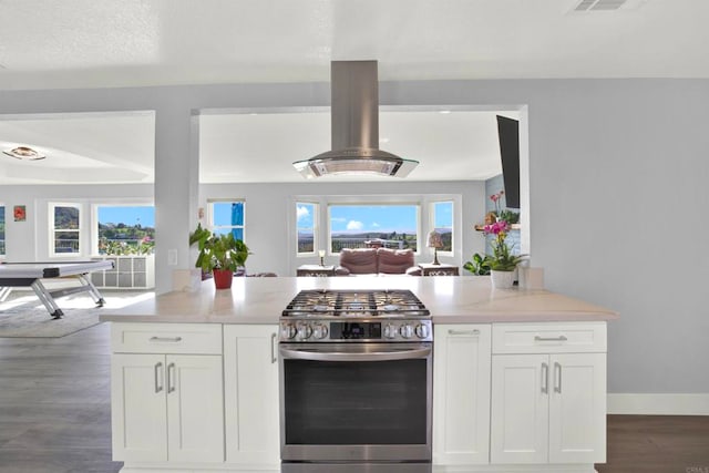 4710 Sleeping Indian Rd, Fallbrook, CA 92028 - kitchen with open floor plan, stainless steel gas range, island range hood, and white cabinets