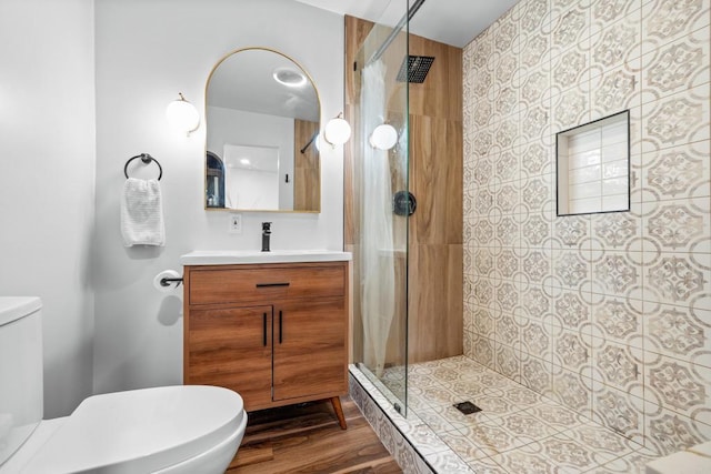 376163 Swift Ave, San Diego, CA 92104 - bathroom with toilet, tiled shower, vanity, and wood finished floors