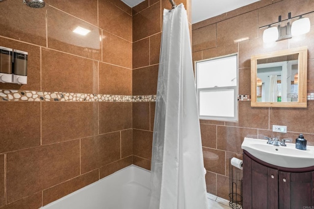 376163 Swift Ave, San Diego, CA 92104 - bathroom featuring shower / tub combo, vanity, and tile walls