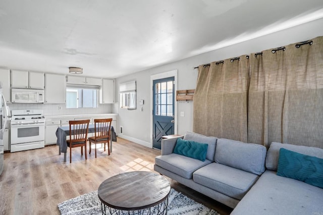 376163 Swift Ave, San Diego, CA 92104 - living area with healthy amount of natural light, light wood-style flooring, and baseboards
