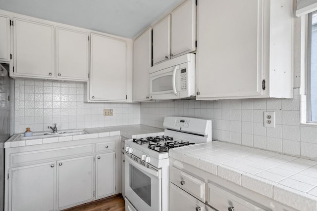 376163 Swift Ave, San Diego, CA 92104 - kitchen featuring white appliances, tasteful backsplash, tile countertops, and white cabinets