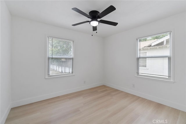1559 N Carruth Ave, Fresno, CA 93728 - spare room featuring baseboards, a ceiling fan, and light wood-type flooring